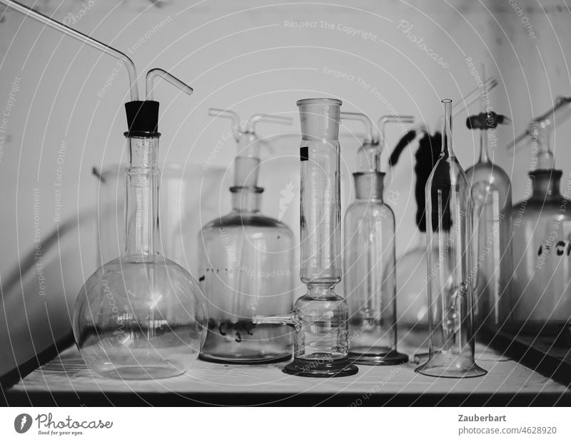 Glass bottles and flasks in a laboratory Piston Glass vessels Laboratory investigation bins analysis Fluid fluid Transparent colourless Bottle Chemistry