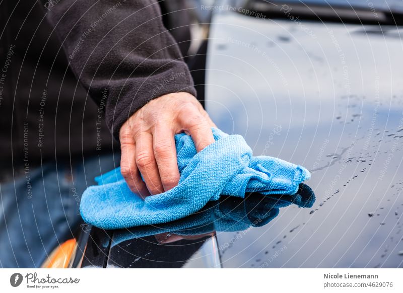 Wash the car with a blue rag work worker preparer preparation auto automobile car care car shampoo car wash exterior outside copy space operation dirt remove