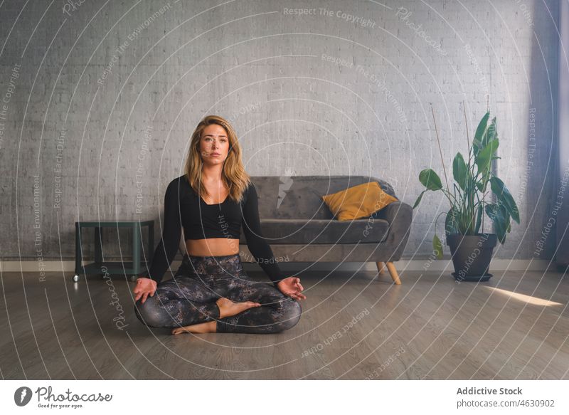 Woman meditating on yoga mat woman mental meditate posture breath practice mudra energy gesture stress relief female recreation eyes closed position recovery