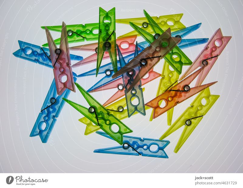 some colored plastic clothespins Clothes peg Untidy Collection Equal X-rayed Accidental Multicoloured Abstract Structures and shapes Artificial light Lightbox