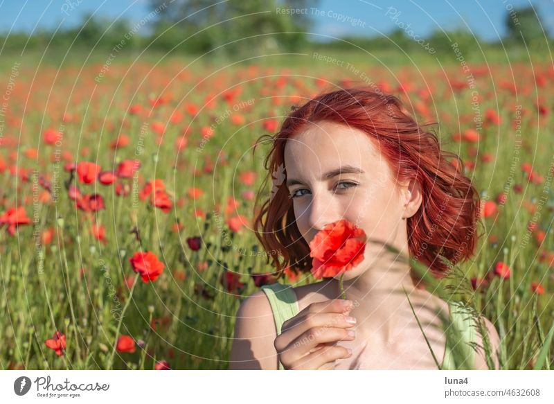 Girl with poppy flower in poppy field Poppy Laughter Poppy field Youth (Young adults) youthful teenager Meadow Flower meadow fortunate cheerful time-out Happy