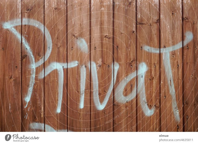 on a closed wooden picket fence stands large - private - / privacy Private Wooden fence wooden slat fence Graffiti Private sphere not open to the public Daub