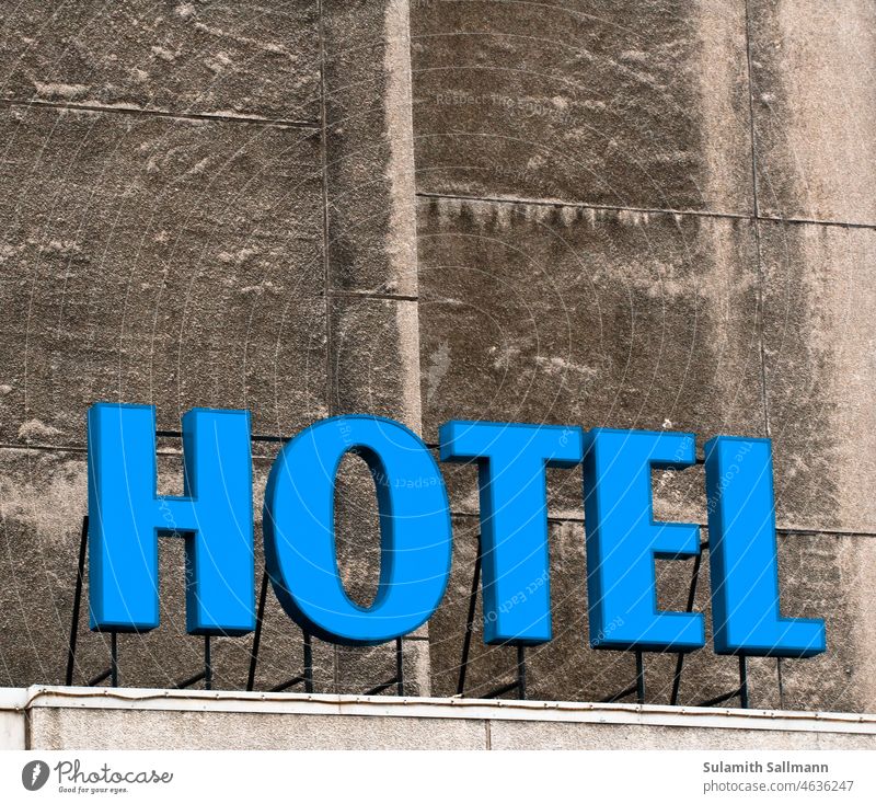 The word HOTEL in blue letters Manmade structures Blue Building Hotel night quarters writing typo typography Word Sign overnight Tourism Clue