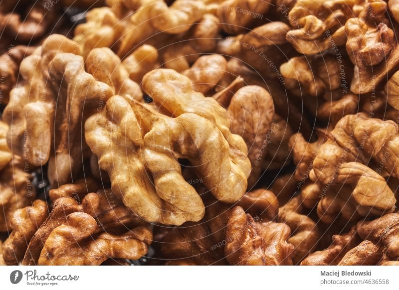 Extreme close up picture of walnuts, shallow depth of field. snack superfood natural healthy nutrition organic ingredient background raw extreme