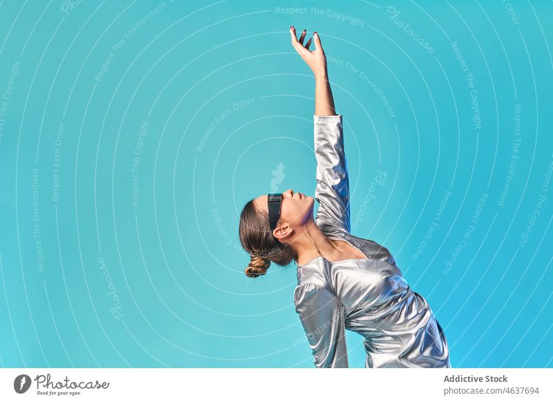 Trendy woman dancing in studio in VR glasses dance virtual reality experience simulate innovation trendy cyberspace vr entertain goggles female young dress