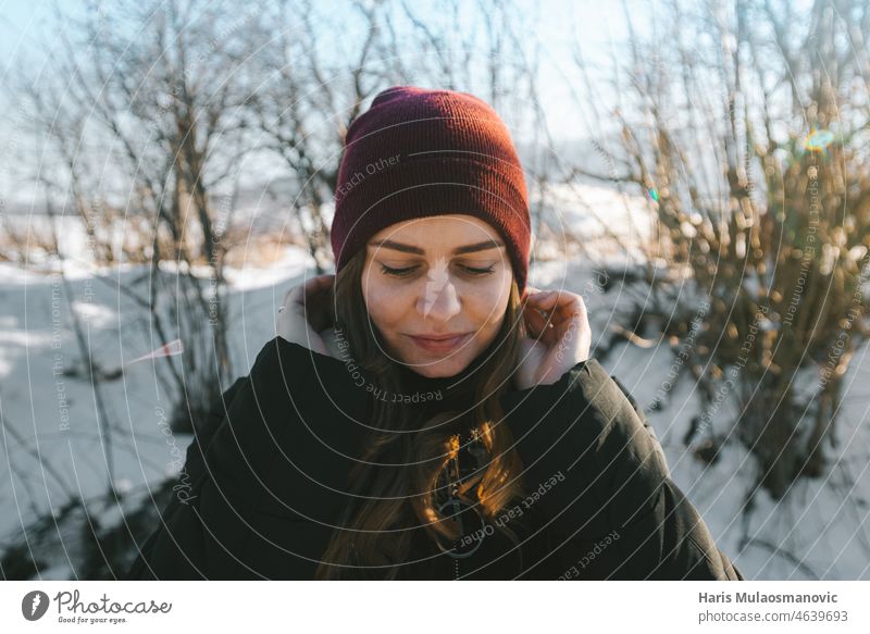 woman enjoying peaceful day in winter attractive beautiful beauty blue caucasian cold face fashion female forest girl happy hat holiday lifestyle nature outdoor