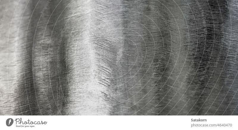 Shiny surface and scratched on stainless steel metal background texture shiny curve industry industrial abstract close up white metallic bright material silver