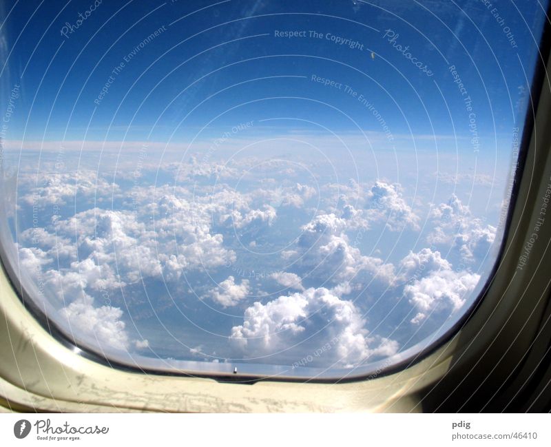 above the clouds Vacation & Travel Aviation Air Clouds Window Airplane Glass Flying Tall Cold Level Aerial photograph