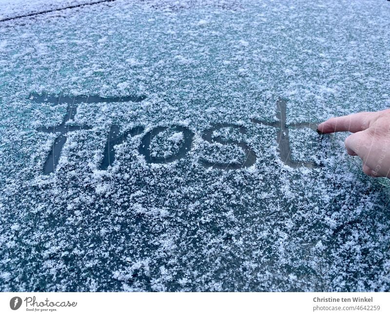 Write "frost" on the frozen car window with your finger - a Royalty Free  Stock Photo from Photocase