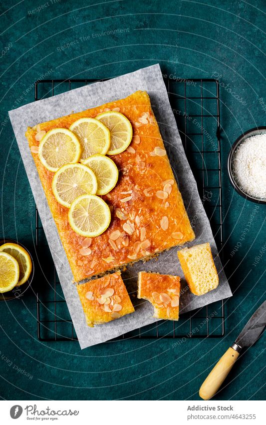Square slice of tasty homemade lemon cake rack baked dessert sweet citrus treat delicious culinary yummy fruit sour kitchen table cuisine fresh piece food