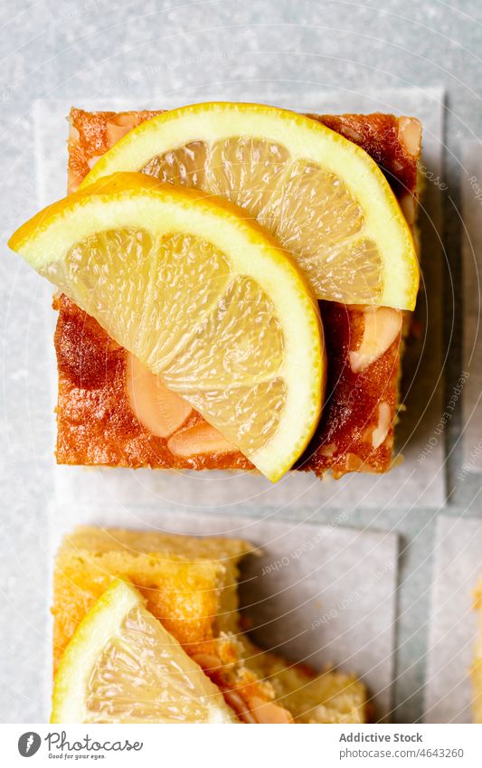 square slice of delicious homemade lemon cake baked dessert sweet portion citrus serve tray fork treat tasty culinary yummy fruit sour kitchen table cuisine