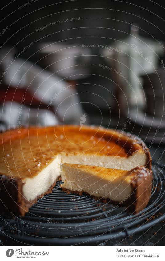 Delicious piece of delicious homemade cheesecake on plate with spoon tasty sweet appetizing serve table baking pan baking dish dessert yummy pastry gourmet