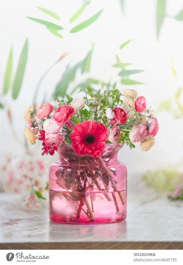 Beautiful pink flower bouquet in glass vase at window background beautiful gerbera rose green leaves bokeh fresh summer front view mothers day birthday