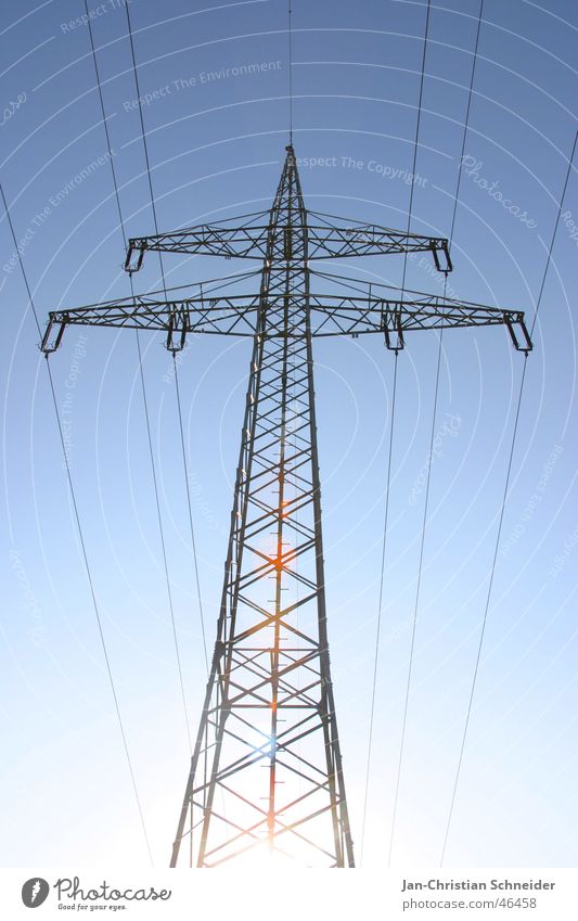 blue electricity Electricity Electricity pylon Cable Mud flats Energy industry Metal Transmission lines powerline Sky Sun