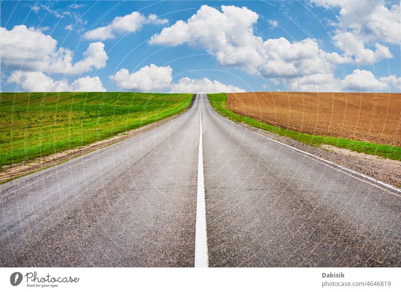 Road through green and agricultural fields road path sky country trip heaven freedom horizon asphalt landscape cloud dream summer day weather perspective