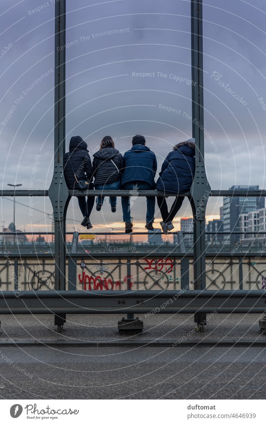 Young people sitting on the Hackerbrücke in Munich free time hacker's bridge Leisure and hobbies group Peer pressure Evening Easygoing Sit Friends Friendship