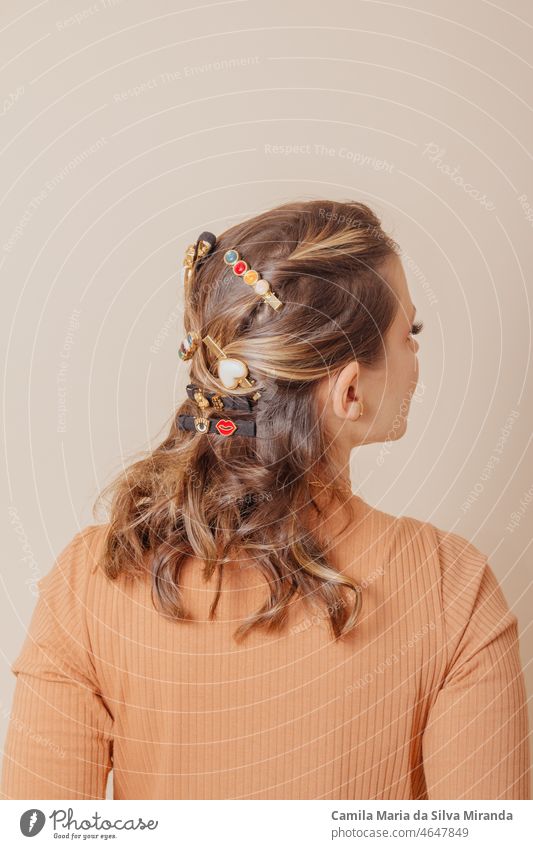 Portrait of woman with clip-on hair accessories on cream background. Autumn concept. autumn beautiful beauty copy space face fashion flower freedom fun girl