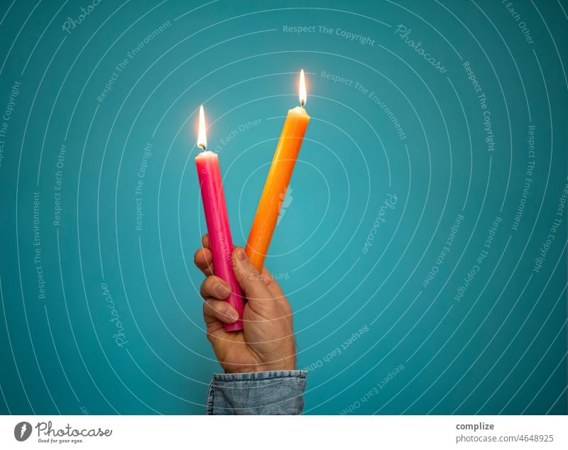 Colorful candles pink & orange burn in hand Birthday celebration Clubbing Creativity Ignite Flame pretty neon Neon trendy birthday candles birthday party