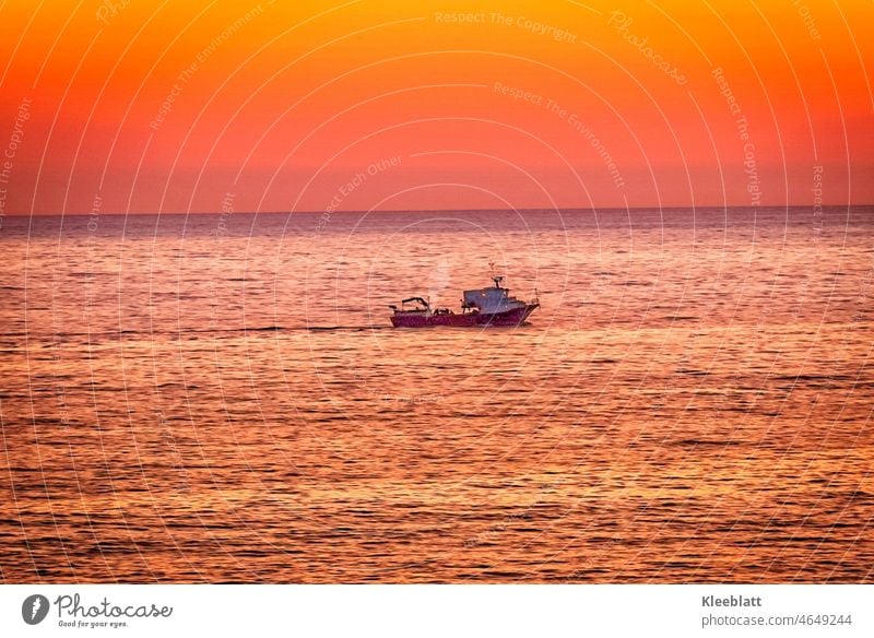 Golden catch - fishing boat off the Sicilian coast Fishing boat Sicily Ocean Island evening mood romantic Play of colours golden orange Bright colours