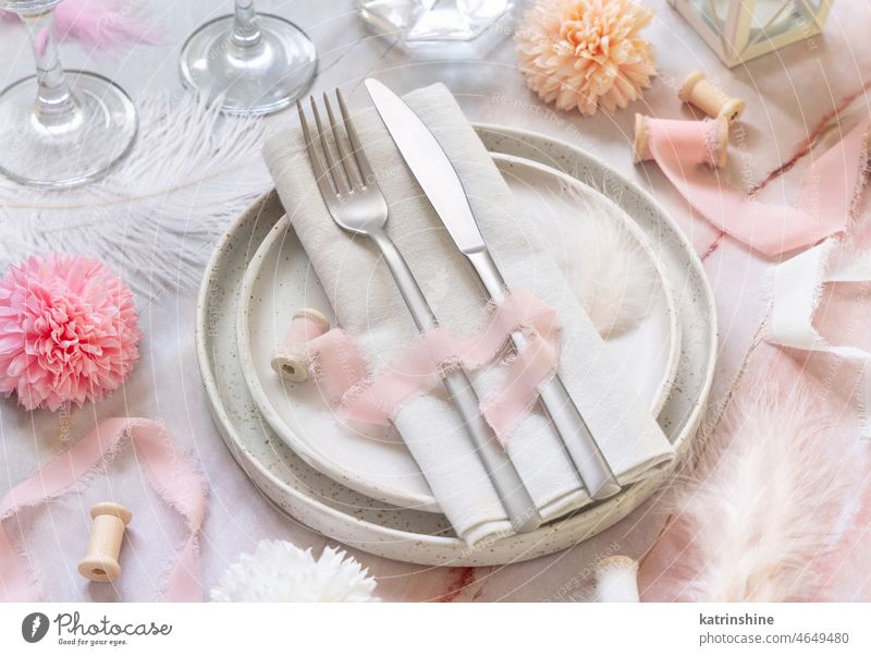 Wedding Table place near flowers, silk ribbons and feathers on a marble table Pink table place Flowers close up Romantic Light Pink pastel Nobody Marble napkin