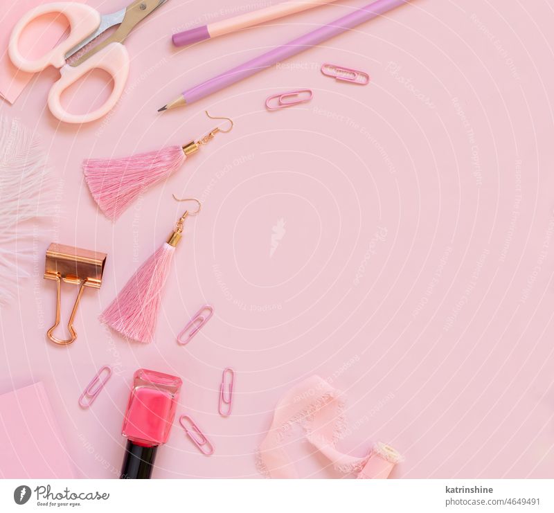 Pink school girly accessories and stationery on pastel pink background Top view education GirlGirly ish nail polish scissors pencils paperclips Back to school