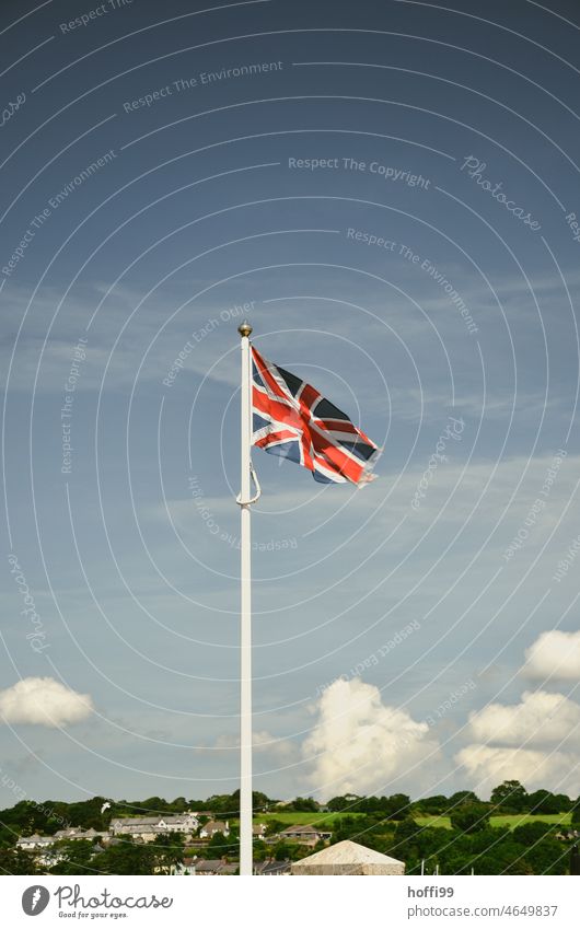 UnionJack with clouds in Cornwall Union Jack United Kingdom flag Great Britain Flag England Europe Flagpole Wind Sky