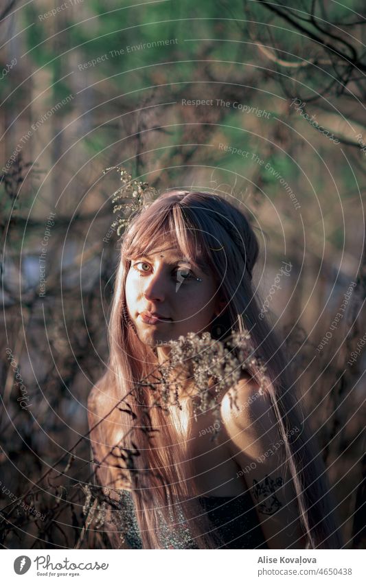 girl in a forest enjoying the sun and fresh air II looking at camera Looking into the camera Human being Portrait photograph Woman Feminine Sunlight sunshine