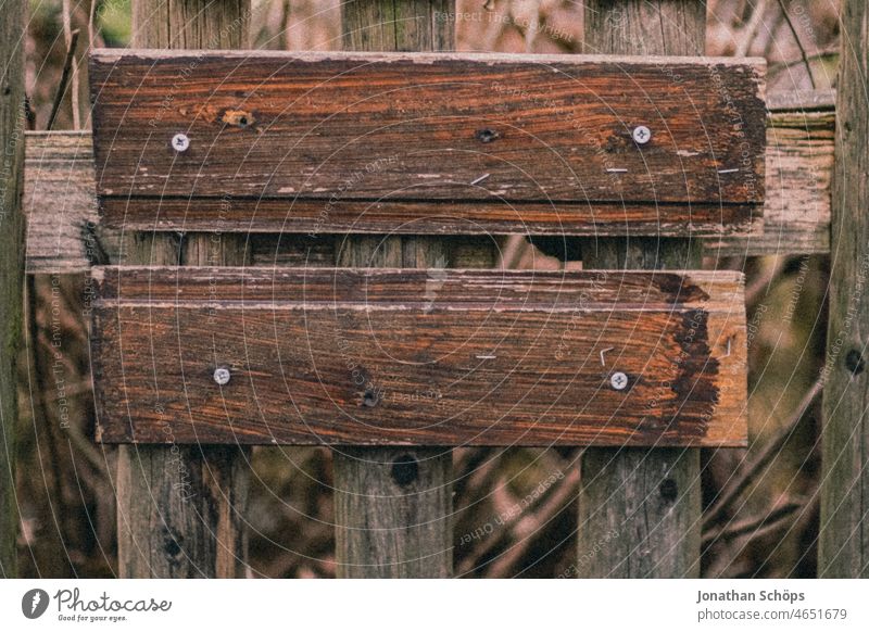 Boards to inscription on wooden fence boards Lettering Wooden fence Copy Space mockup screwed on Wooden board Fence Close-up Exterior shot Colour photo Deserted