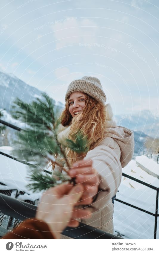 Smilling girl with tree christmas branch Girl Beautiful Attractive snow winter portrait female cold nature Woman white people outdoors mountain christmas time