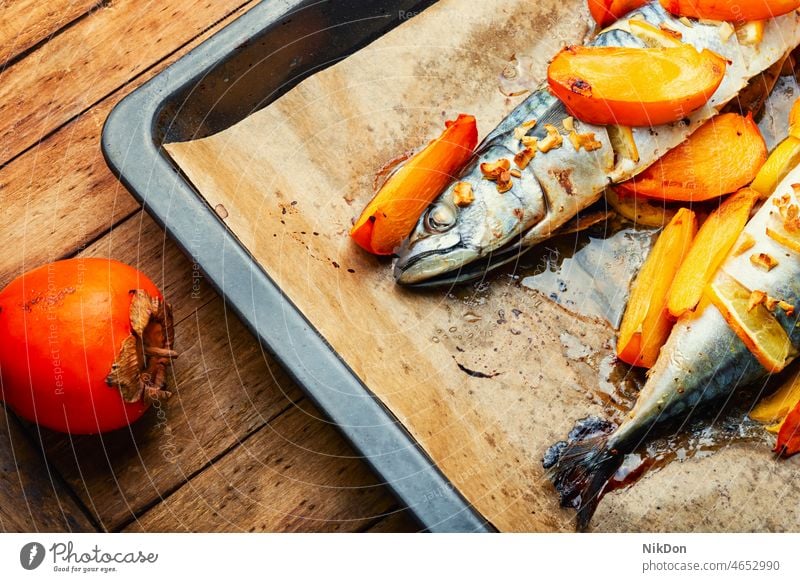 Baked scomber fish with persimmon. mackerel food roasted seafood fruit grilled lunch baked meal cooking healthy dinner diet lemon delicious gourmet cuisine