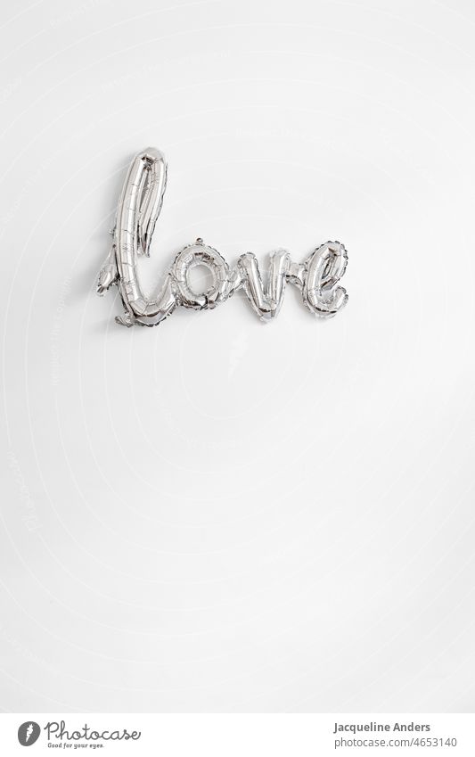 Writing Love as a silver balloon on the wall Silver Valentine's Day valentine valentines day Word Letters (alphabet) Wall (building) In love message Romance