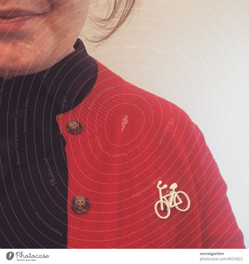 Bike Nerd Frontal Woman pink Bicycle Brooch Name badge Cardigan fashionable Fashion Face Mouth Smiling Selfie portrait Human being pretty Adults Happy Clothing