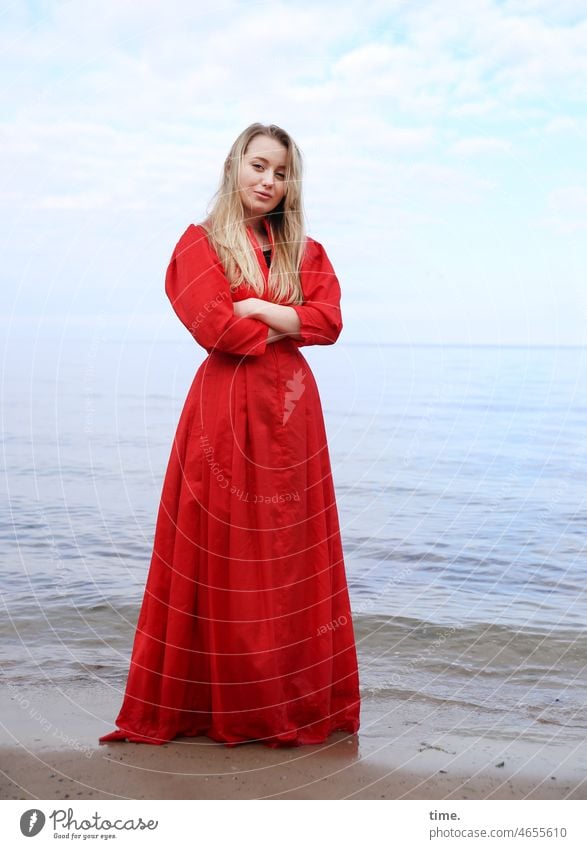 Lena portrait Dress crossed arms Long-haired Baltic Sea Blonde Feminine Red Ocean Water Beach Sand Waves Observe Pride Meditative Stand Inspiration pretty