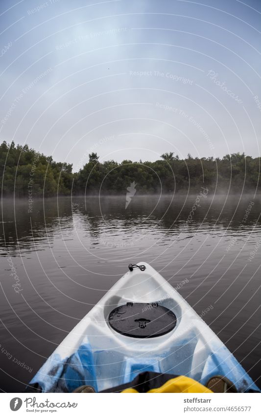 Kayak along the misty Orange River in Fort Myers river water sports tranquil relaxing Florida misty water fog foggy boat paddle calm placid