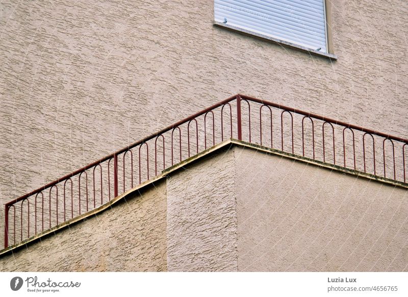 An empty balcony and a closed shutter above it, plus a railing that no longer protects anyone Balcony Architecture House (Residential Structure) Window Building