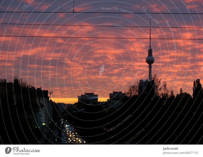In the evening the sky shines over the big city Berlin TV Tower Landmark Capital city Clouds Sky Overhead line Silhouette Prenzlauer Berg City Panorama (View)