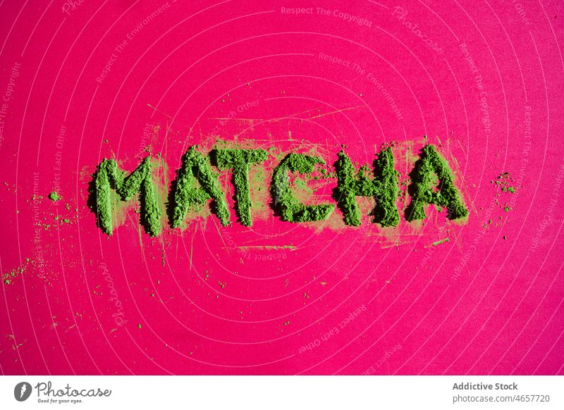 Word matcha made of powdered tea on bright surface dried inscription word vivid japanese oriental culture vibrant creative color leaf natural herbal art
