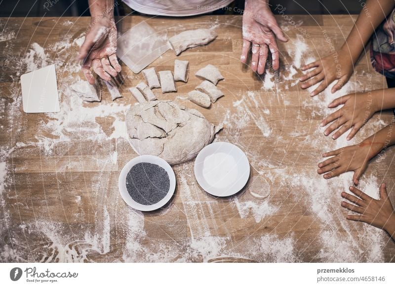 Hands kneading dough. People making dough for bread during bread making workshop baking baker flour bakery food person preparation cooking table occupation
