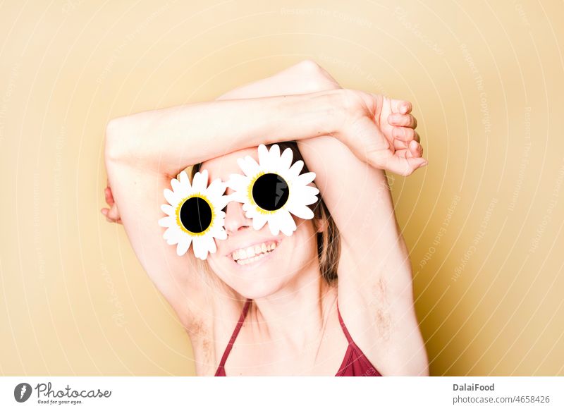 woman with daisy glasses smile hands yellow background