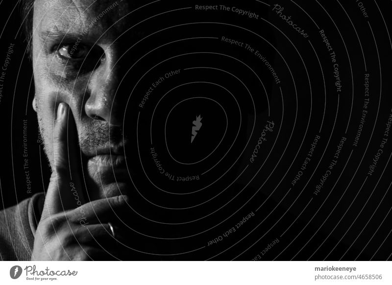 Black and white portrait of a Caucasian man guy expression human serious confident eye emotion model look dramatic expressive shadow 40s black and white
