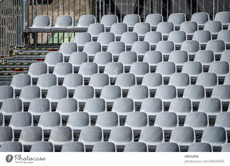 Empty Seats Of An Open Air Venue seat row empty hollow blank vacant venue open air seating theater grandstand tribune background concept conceptural