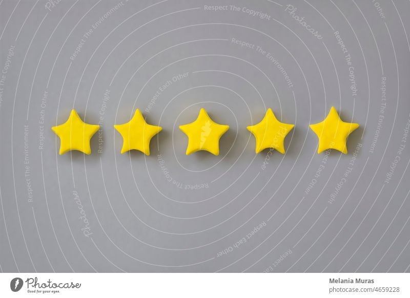 Five star in a row on grey background. Golden star shape. Concept of top class, best quality product symbol. Sign of  evaluation, feedback from customer. 3d 5