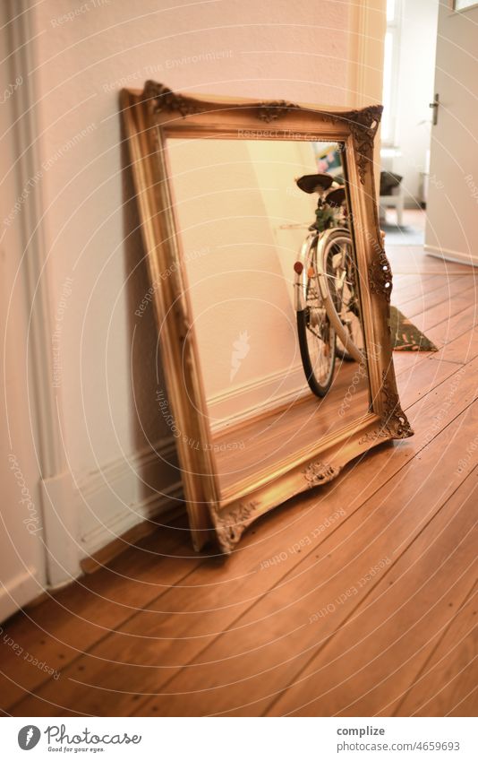 Antique mirror with ornate frame stands in the hallway of an old building apartment Ancient Mirror vintage Frame Ornate Baroque Picture frame Mirror image