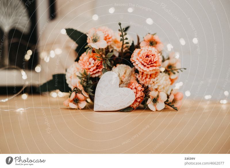 Wooden table with a bouquet of flowers and a white heart Heart White Table Copy Space background Floral Bouquet Heap nobody bokeh clearer Work area Day Writing