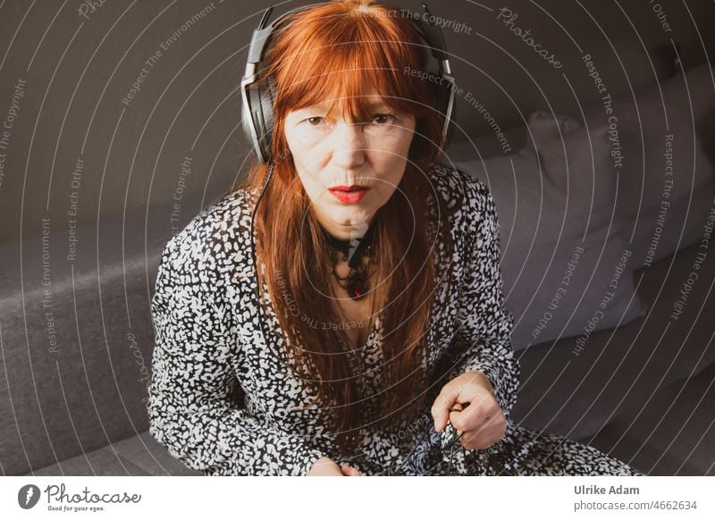 listen to music Analog Technology Lifestyle Listening Music portrait Red-haired Woman Headphones Listen to music Leisure and hobbies To enjoy