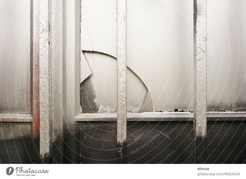 barred window with broken pane, sprayed silver and black Window latticed Broken Pane sprayed on Silver Black Building Glass Destruction Transience Window pane