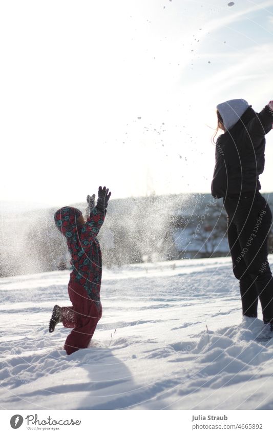 yay fun in the snow Snow Infancy Child Winter Winter vacation Winter mood Winter's day muck about Kindergarten Throw Playing Snowsuit Hooded (clothing) Gloves