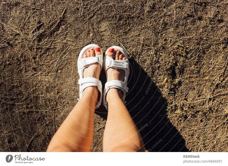 Directly above selfie of female feet with white sandals and red nails foot shoe summer leg fashion beach travel beauty standing slipper high angle view