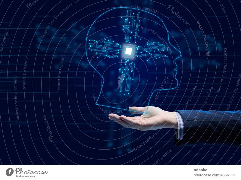 The concept of teaching artificial intelligence to various tasks, replacing human mental labor. Above the female hand is a luminous hologram of the head with connections
