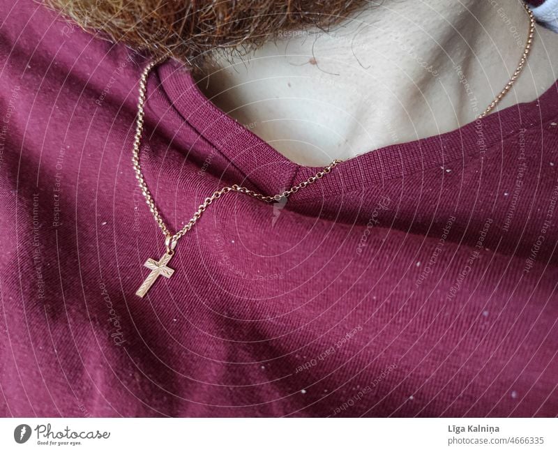 Small golden crucifix on shirt around neck Necklace Crucifix Chain Close-up necklace Gold Christianity Christian cross Church Symbols and metaphors